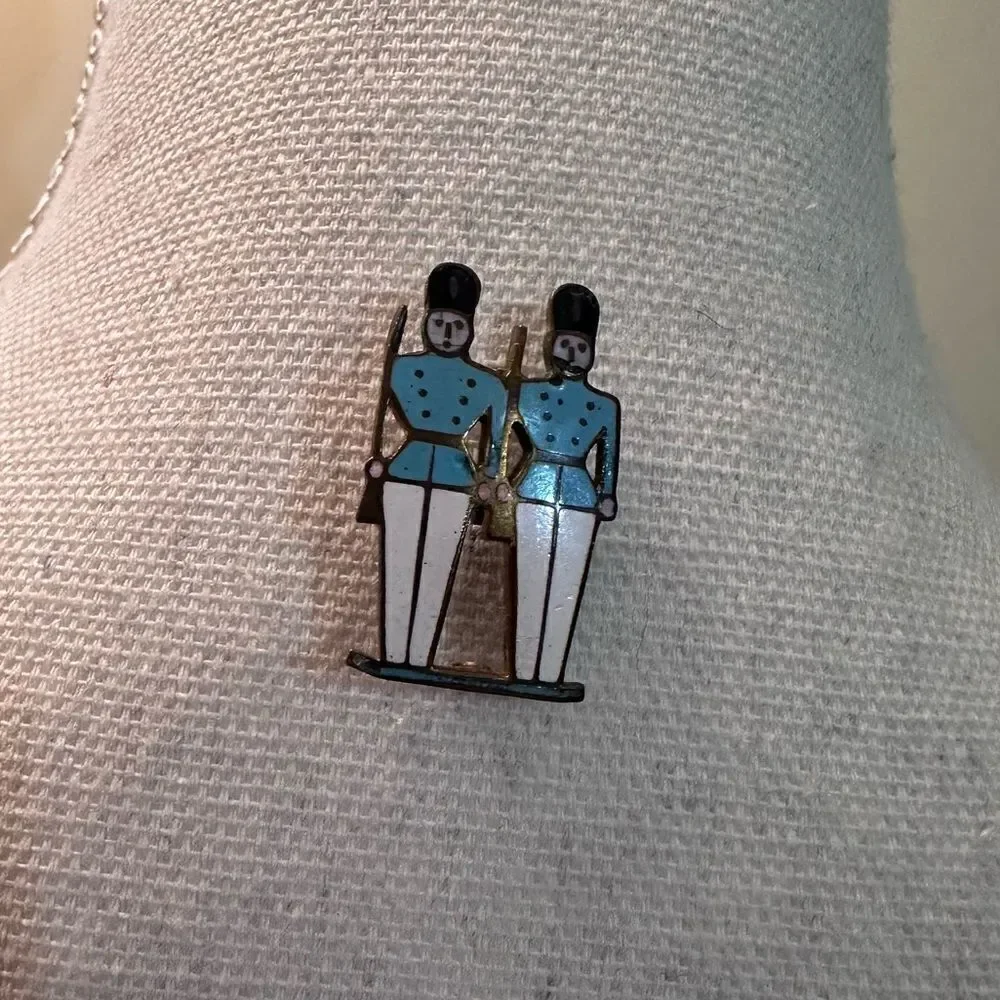 Vintage enamel on gold tone metal soldiers pin brooch